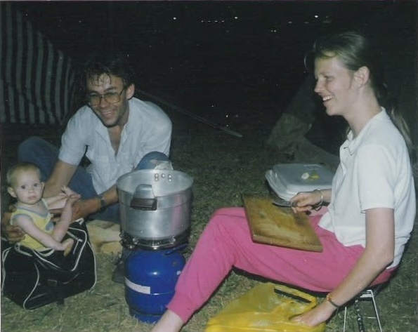 Baby Muriel with her parents at a campsite at night
